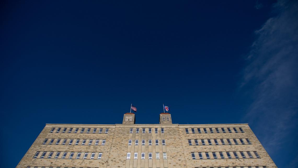 Angled view of Fraser Hall against dark blue sky